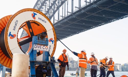 Crews on a barge lay cable under Sydney Harbour Cropped